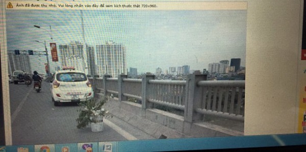 Sự thật về thông tin CSGT dùng taxi ‘bẫy’ xe máy trên cầu Vĩnh Tuy