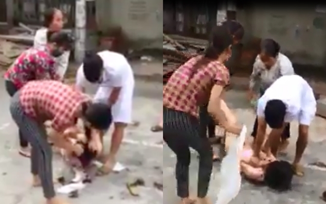 Bắt quả tang chồng quan hệ ngoài luồng, vợ cùng người thân cắt tóc lột đồ tình địch