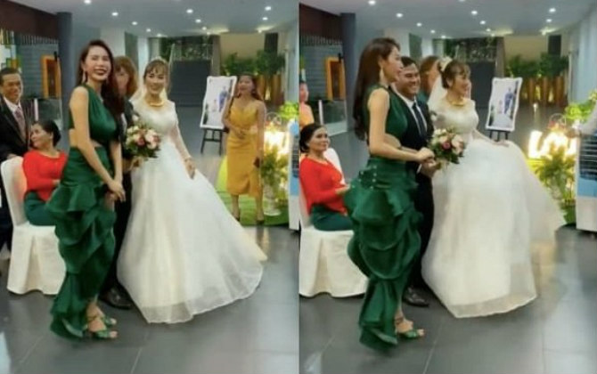 Đi ngang qua đám cưới, ca sĩ Thủy Tiên liền nán chân ở lại chụp ảnh với cô dâu chú rể và gửi lời chúc phúc