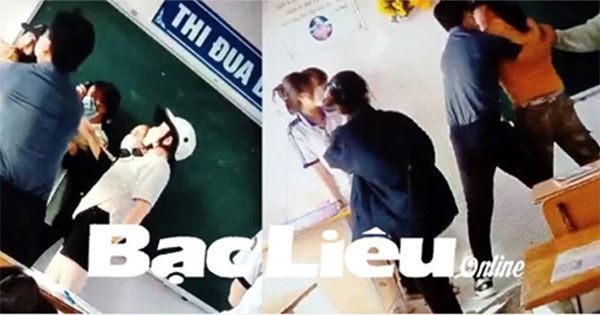 Phụ huynh xông vào lớp học đánh bạn của con gái bất chấp sự can ngăn

