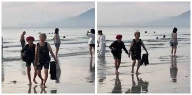 Hai cụ bà nắm tay nhau tắm biển, ai xem cũng mong sau này già đi có một người bạn như thế